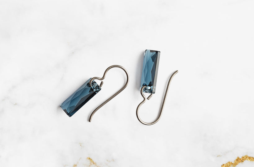 Beautiful titanium earrings, designed with delicate simplicity, adorned with high quality crystals and other gems to instantly upgrade your look. Be curious, seductive and daring and don't be afraid to show it.