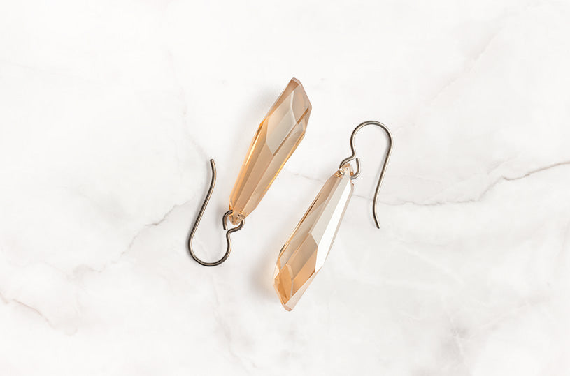 When you are happy, positive and full of energy choose the Titanium earrings with high quality crystal and carry on smiling. Wear them when you desire to be noticed for your bold choices.