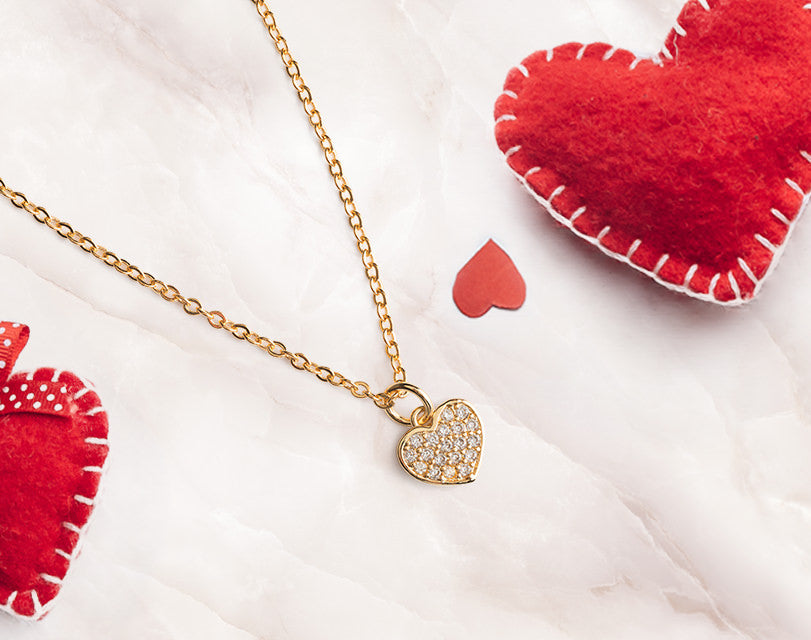 This gold plated 16 inch cubic zirconia heart pendant necklace brings elegance and style and instantly upgrades your look. Match if with a pair of our cubic zirconia heart hoop earrings to make a fashion statement.